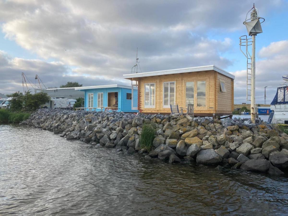Waterhuisjes Op De Pier Van Lauwersmeerplezier! Лауэрсог Экстерьер фото